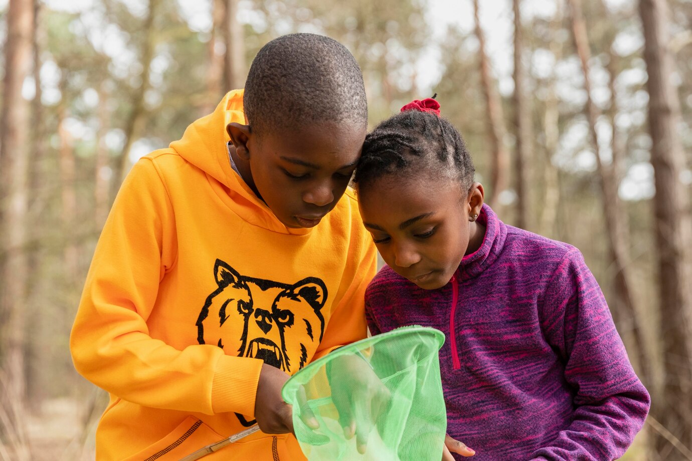 kids-looking-through-their-fishing-nets_23-2148943165